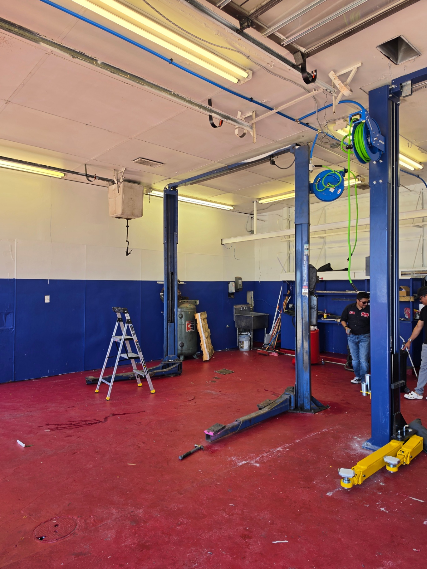 Inside Diaz Auto Clinic: service bay with a two-post lift ready for vehicle work on Annapolis Rd in Bladensburg